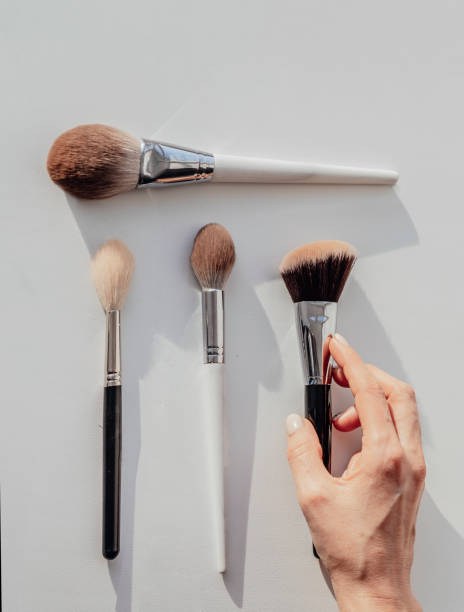 istock Woman holds brush for professional makeup. brushes set 1347037215