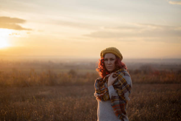 istock Woman walking alone in the forest 1347042764
