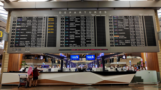 Singapore- 9 Dec, 2019: Flight info panel at Changi Airport Singapore. Singapore airport provides the best shopping experience to the passengers.