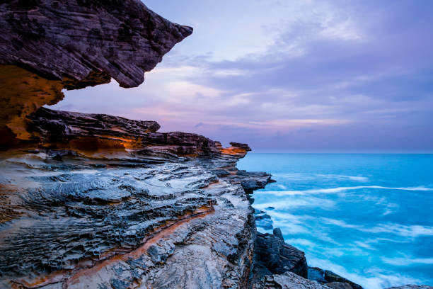 istock Rock Formation along Pacific Coastline against Cloudy Sky 1347042996