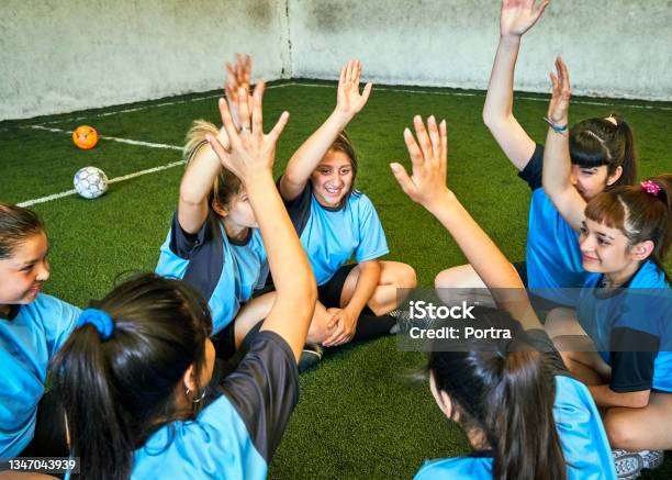 Female Soccer Team Motivating Each Other Before Game Stock Photo - Download Image Now