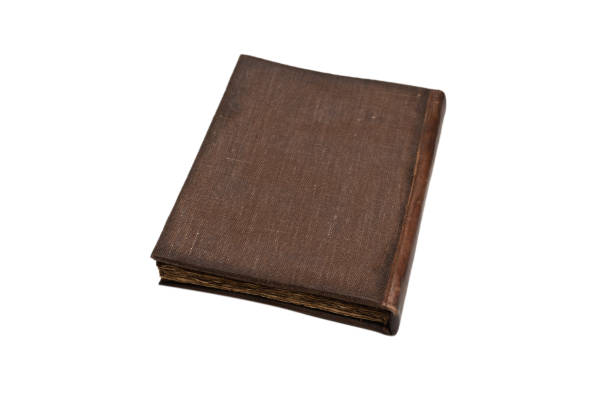 istock An old brown book isolated on white background. 1347045500