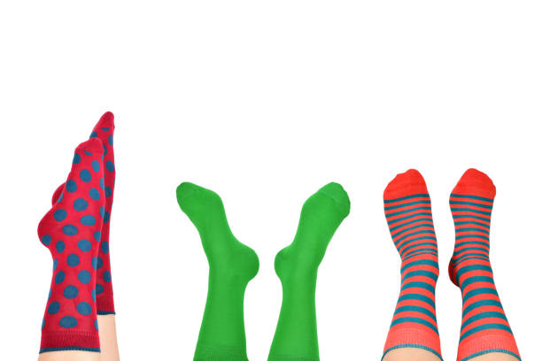 istock Woman in blue socks isolated on white background. 1347045551