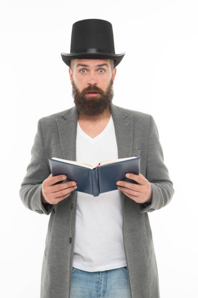 istock Wow. Surprised library reader. Hipster read library book. Bearded man wear top hat in casual style. Borrowing literature from library. Knowledge and education. When in doubt go to library 1347047638