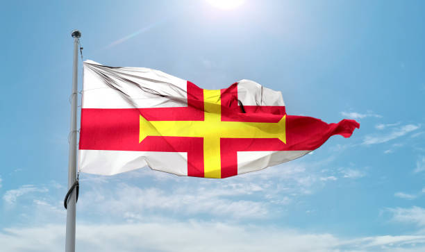 istock Guernsey flag - realistic waving fabric flag. 1347048432