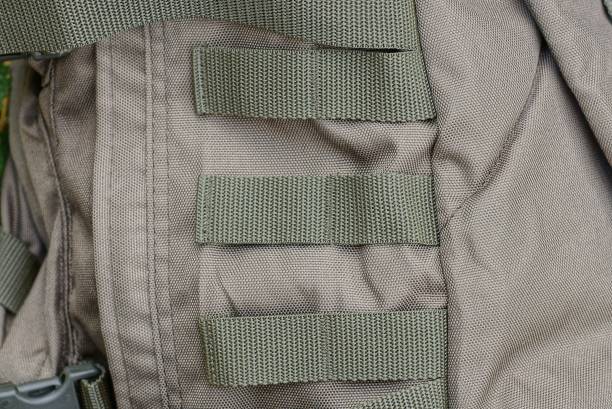 istock three green harness stripes on the gray fabric 1347048570