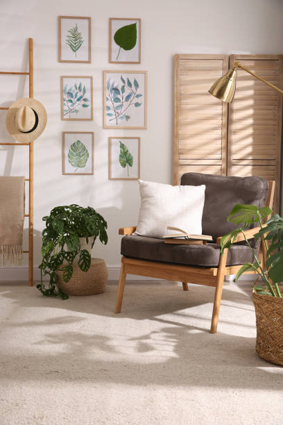 istock Stylish room interior with different artworks and armchair 1347049834