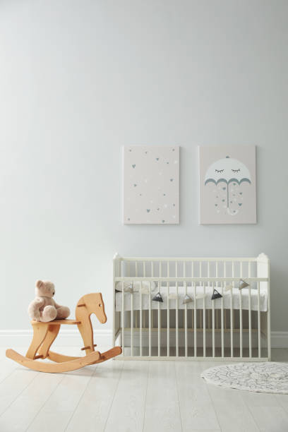 istock Minimalist room interior with baby crib, decor elements and toys 1347050249