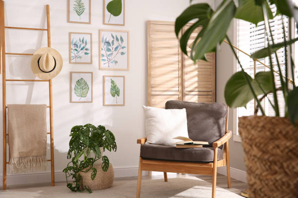 istock Stylish room interior with different artworks and armchair 1347052048
