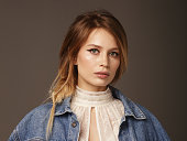 Portrait of beautiful and stylish woman wearing denim jacket