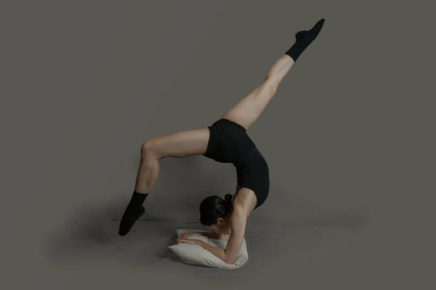 istock A dancer dressed in black crawls on the ground to practice dance moves 1347053498