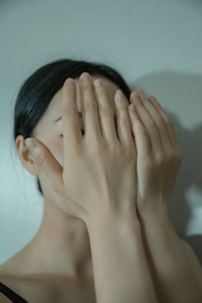istock A dancer dressed in black holds her face in her hands 1347054281