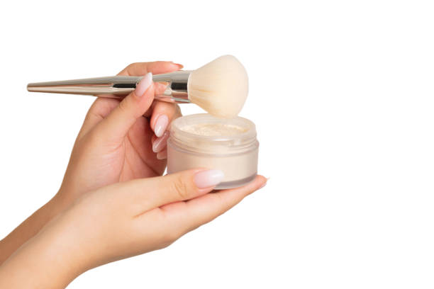 istock Woman hand holding loose powder 1347056725