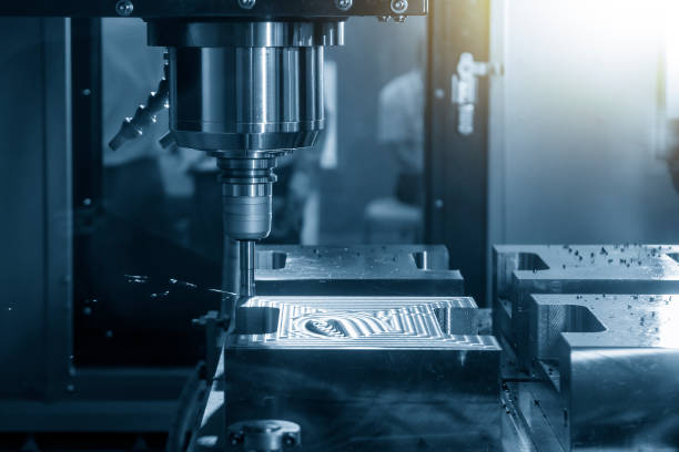 istock The CNC milling machine rough cutting the injection mold parts by indexable  endmill tools. 1347058254
