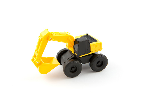 Excavator plastic toy isolated on white background