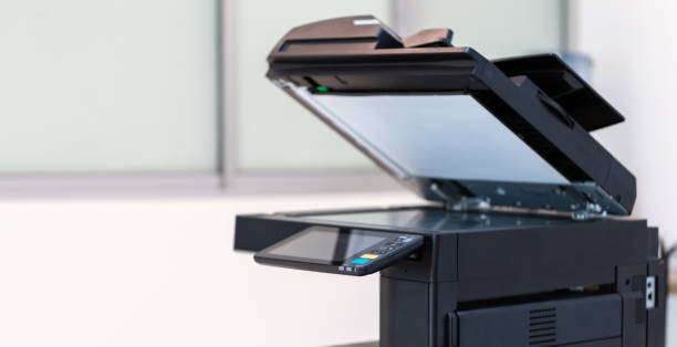 istock photocopier or network printer is office worker tool equipment for scanning and copy paper. 1347059243
