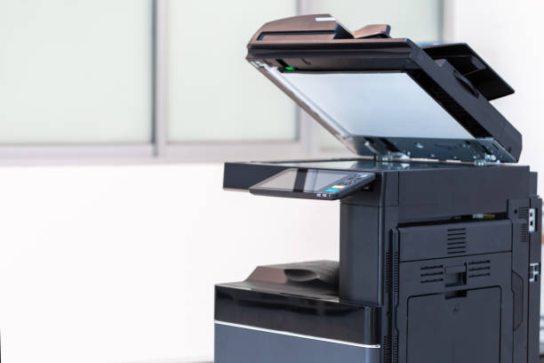 istock photocopier or network printer is office worker tool equipment for scanning and copy paper. 1347059249