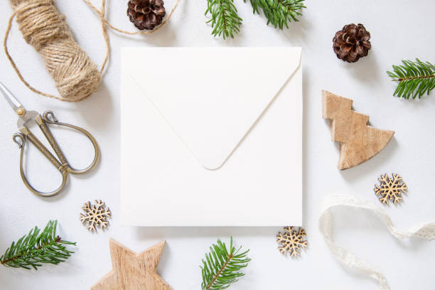 istock Christmas Composition with a card over sealed envelope flat lay 1347063818