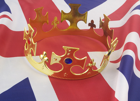 Monarchy in United Kingdom concept. King crown on UK flag.