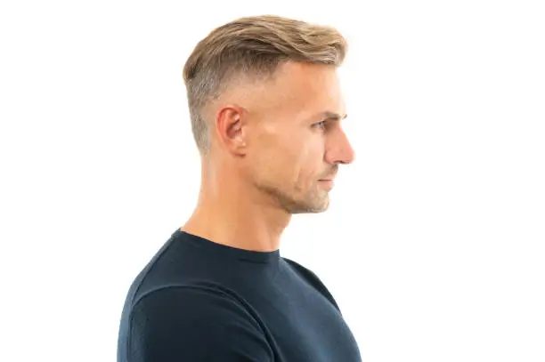 Seriously handsome. Portrait of man in profile. Caucasian man side-face. Serious guy side-on isolated on white. Mens haircut and hairstyle.