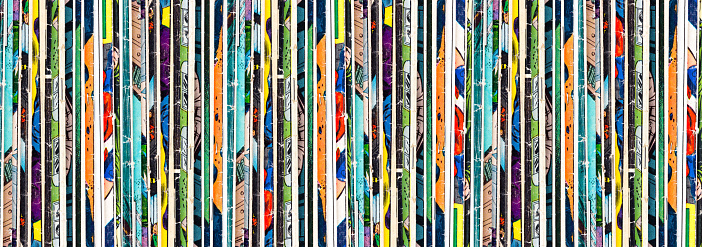 Vintage comic books stacked in a vertical row background banner