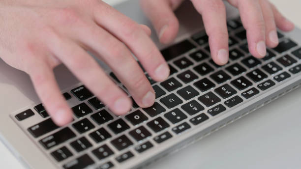 istock Close up of Hands Typing on Laptop 1347076038