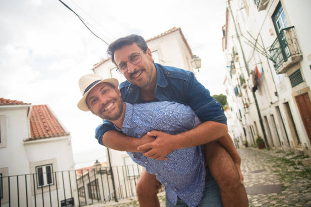 istock Smiling gay couple on date 1347076191