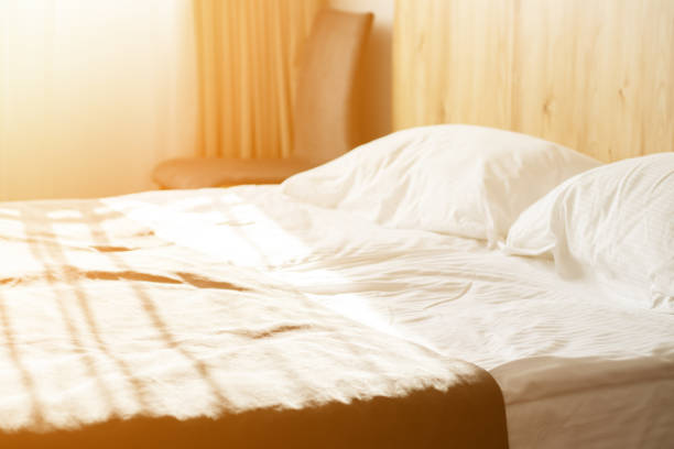 istock hotel service, bed in a room with clean linen interior 1347077126