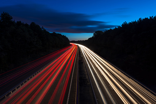 High-speed cars leave beautiful light tracks.