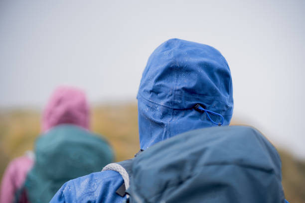 istock Hiking couple follow footpath through dense fog 1347079272