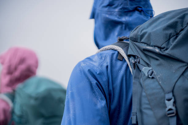 istock Hiking couple follow footpath through dense fog 1347079366