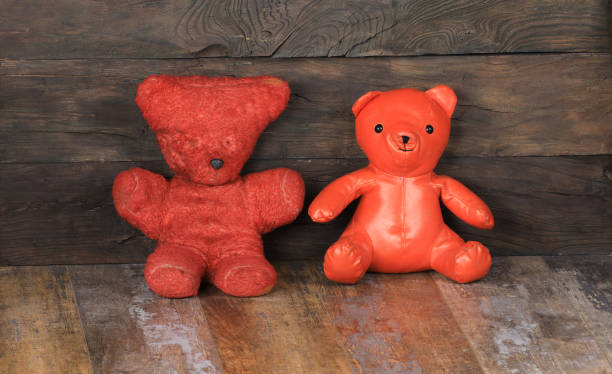 istock antique red toy bear on old wooden background 1347080472