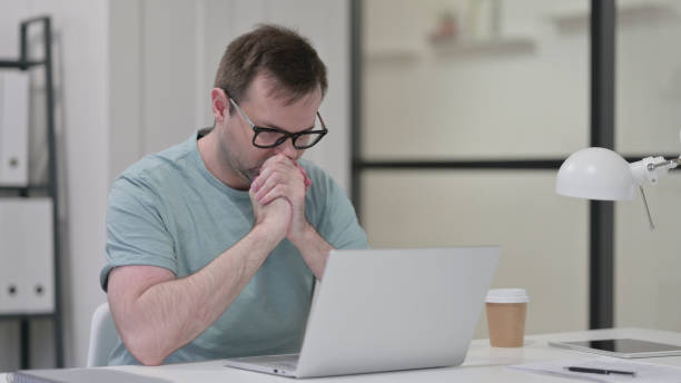 istock Young Man with Laptop Feeling Angry, Disappointed 1347080501