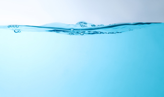 clean blue water waves splashing water background and bubbles