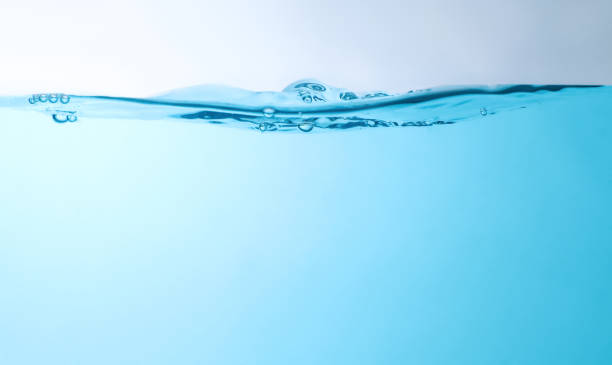 Blue bubbles underwater flowing up to the surface clean blue water waves splashing water background and bubbles photo png pictures stock pictures, royalty-free photos & images