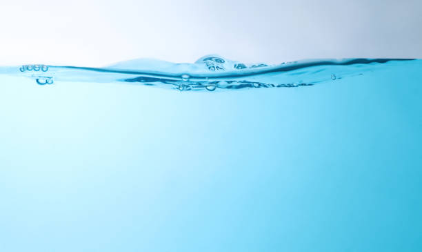 blue bubbles underwater flowing up to the surface - vatten bildbanksfoton och bilder
