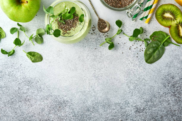 ingredients for green smoothie, fresh organic spinach pea microgreens, banana, kiwi, apple and chia seed over light grey concrete background. healthy eating ingredients. top view, copy space - healthy eating food and drink nutrition label food imagens e fotografias de stock