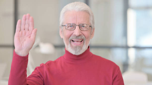 istock Old Man Waving to Say Hello, Welcoming 1347081678