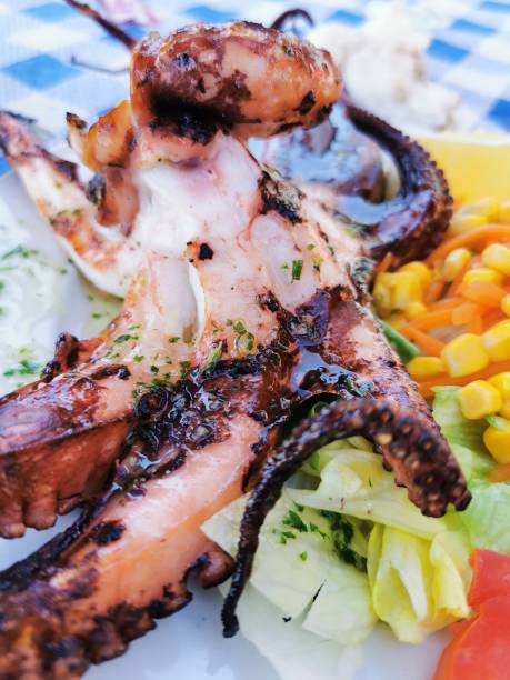 istock Traditional Spanish dish of octopus grilled on the beach 1347083271