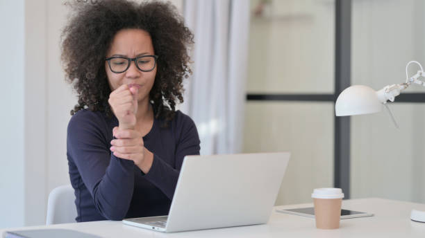 istock African Woman having Wrist Pain while using Laptop 1347083659