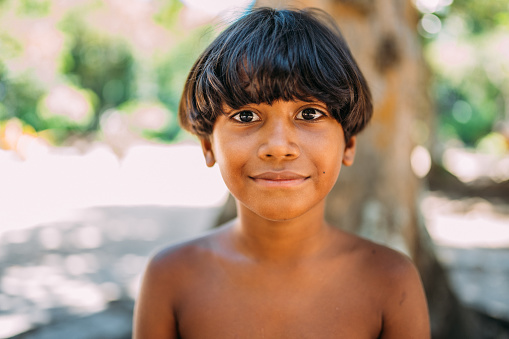 young Indian from the Pataxo tribe of southern Bahia. Indian child smiling and looking at the camera. Focus on the face