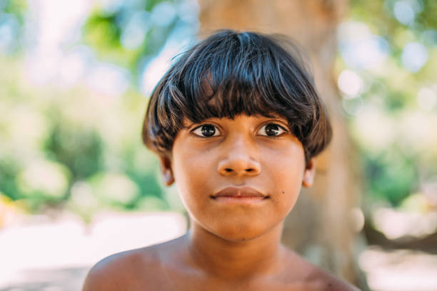 young Indian from the Pataxo tribe of southern Bahia. Indian child looking at the camera. Focus on the face
