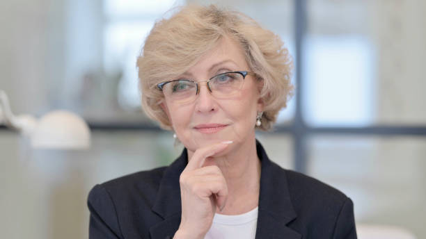 istock Pensive Old Businesswoman Thinking 1347086178
