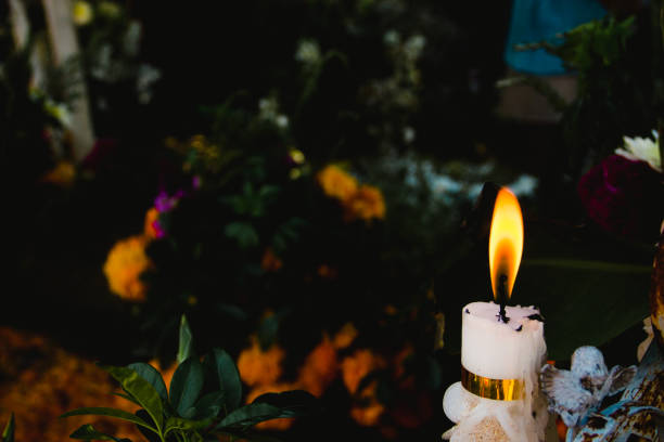 istock Candle light with cempasuchil flower on the background 1347086247