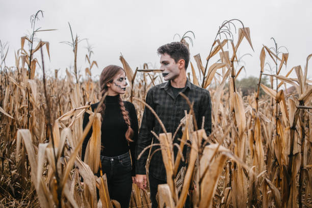 istock A young couple disguised as zombies in a cornfield for Halloween 1347086911