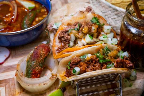 istock Three Authentic Tacos, Birria, Chicharone, Beef Steak adobo, Beef Consume, Chile Peppers 1347087223