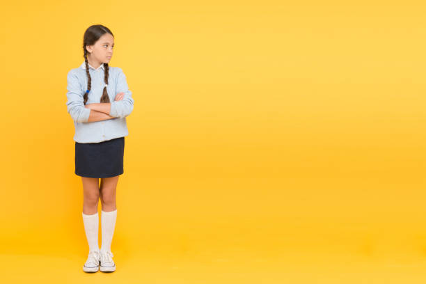 istock Educational activity. Homeschooling or visiting regular school. Efficiency of studying. Adorable schoolgirl. Diligent schoolgirl. Schoolgirl calm serious pupil long hair. Beginning of academic year 1347088977