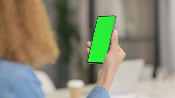 istock African Woman using Smartphone with Green Screen 1347089017
