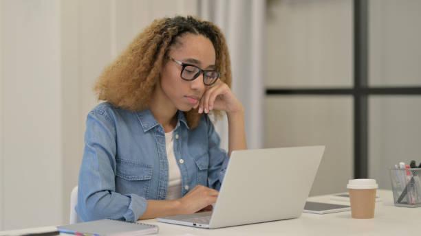 istock African Woman Working on Laptop in Office 1347089907