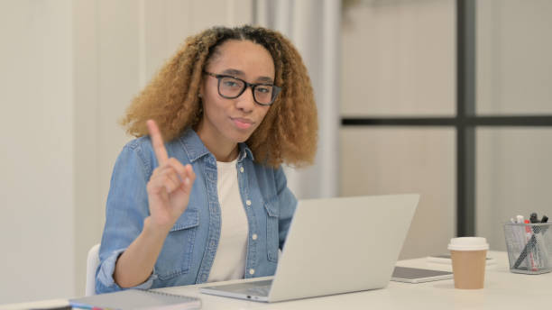 istock No Gesture with Finger by African Woman at Work 1347091270